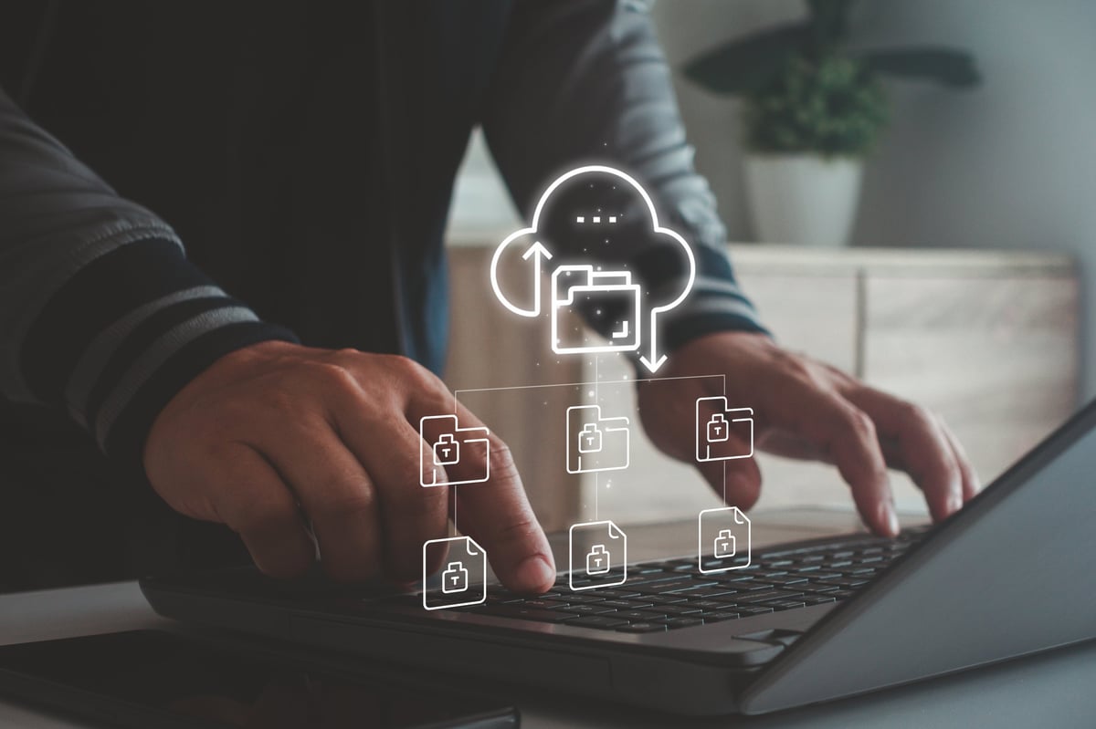 Person working remotely on a laptop connected to cloud-based internet services
